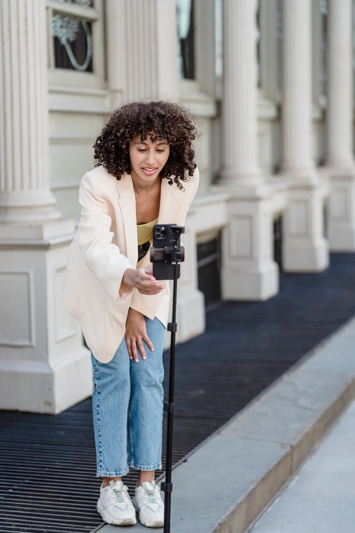 Creator filming a video with a phone on a tripod