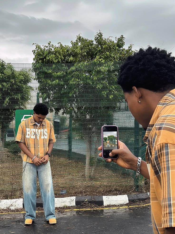 Creator filming a friend's outfit video on a phone